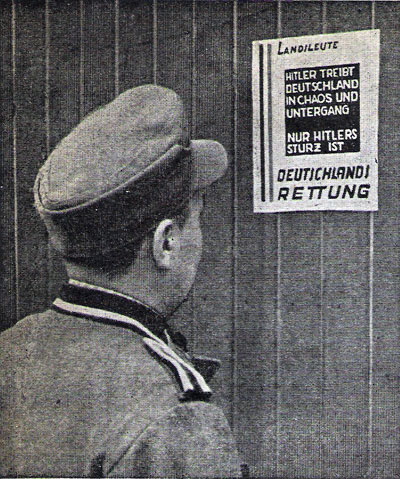 A German soldier is reading a poster from Die deutsche Frieheitsbewegung zur Zeit der Besetzung Dänemarks. In the files of Holger Terp.